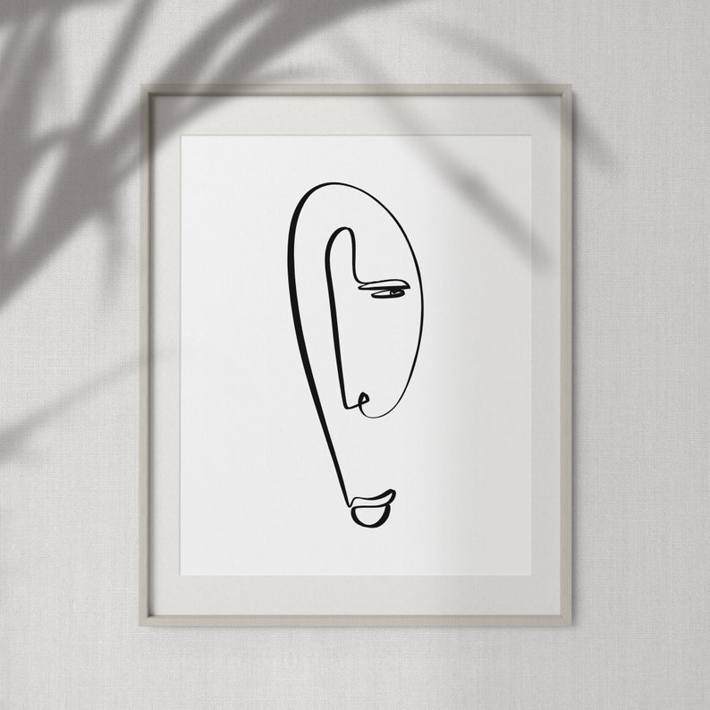Puede incluir: Un dibujo en blanco y negro de una cara en un estilo simple y minimalista. La cara est&aacute; dibujada con una sola l&iacute;nea continua, creando una sensaci&oacute;n de movimiento y fluidez.