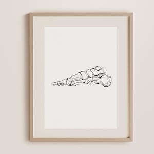 May include: A black and white line drawing of a foot skeleton, framed in a light wood frame.