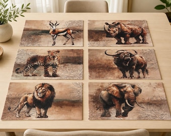 May include: A set of six rectangular placemats, each with a different African wildlife illustration. Animals include an antelope, rhino, leopard, buffalo, lion, and elephant. The artwork is in brown and beige tones, giving a rustic appearance.