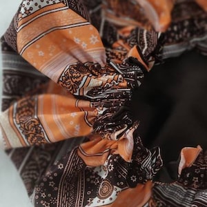 Wax and satin cap