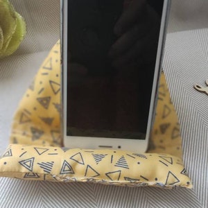 Mobile phone cushion and tablets. Yellow and black phone holder pyramidal cushions.