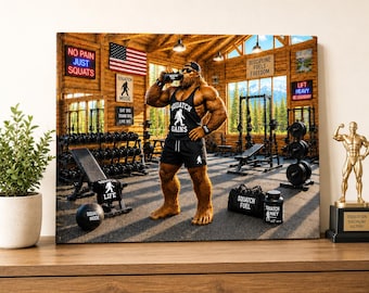 May include: A canvas print depicts a muscular Sasquatch in a gym setting, drinking from a bottle. The gym features weightlifting equipment, motivational signs, and an American flag. The Sasquatch wears a black tank top and shorts with the text "Squatch Gains".