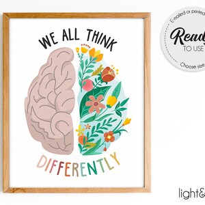 Könnte beinhalten: Ein druckbarer Kunstdruck mit einer Gehirnform, die auf der einen Seite mit bunten Blumen gefüllt ist und auf der anderen Seite eine Gehirnform. Der Text "WE ALL THINK DIFFERENTLY" befindet sich unterhalb der Gehirnformen. Der Druck ist in einem hellen Holzrahmen gerahmt.