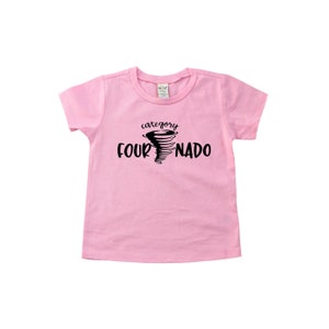 May include: Pink short-sleeved t-shirt with a black graphic of a tornado and the text "category four-nado".