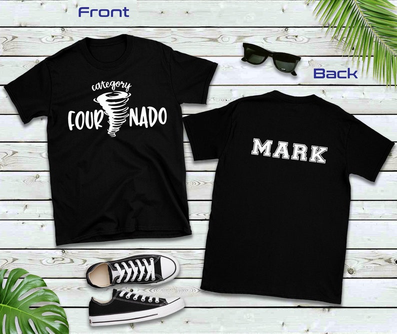 May include: Black t-shirt with a white graphic of a tornado with the text "category four NADO". The back of the shirt has the name "MARK" in white letters.