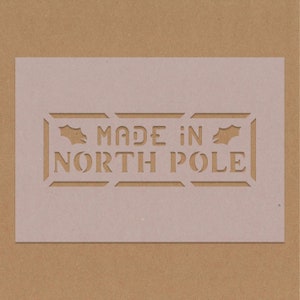 Made in the North Pole Dekorative Weihnachtsschablone Seasons Greetings