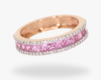 Könnte beinhalten: Ein Roségold-Bandring mit einer doppelten Reihe von rosa Saphiren und Diamanten.