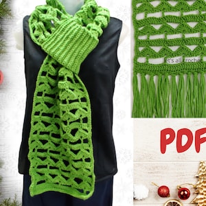 May include: Green crochet scarf with a lacy pattern and fringe. The scarf is shown being worn by a person. The image also includes the text "Let's all crochet" and "PDF".