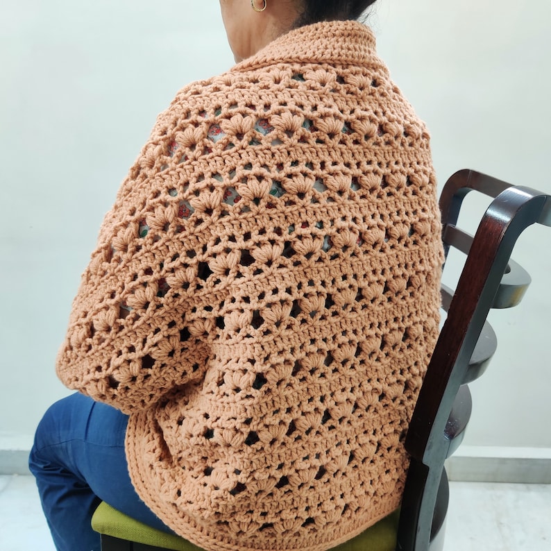 Crochet Pattern Cocoon shrug medium weight lion brand yarn. Easy beginner crochet cocoon cardigan or boho crochet sweater for women in sizes XS to 5XL. Blanket shrug made from rectangle with easy lacy pattern of puff stitch and half double crochet.