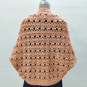 Crochet Pattern Cocoon shrug medium weight lion brand yarn. Easy beginner crochet cocoon cardigan or boho crochet sweater for women in sizes XS to 5XL. Blanket shrug made from rectangle with easy lacy pattern of puff stitch and half double crochet.