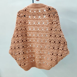 Crochet Pattern Cocoon shrug medium weight lion brand yarn. Easy beginner crochet cocoon cardigan or boho crochet sweater for women in sizes XS to 5XL. Blanket shrug made from rectangle with easy lacy pattern of puff stitch and half double crochet.
