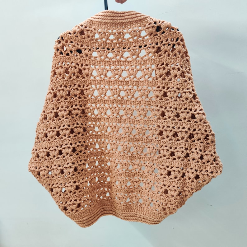Crochet Pattern Cocoon shrug medium weight lion brand yarn. Easy beginner crochet cocoon cardigan or boho crochet sweater for women in sizes XS to 5XL. Blanket shrug made from rectangle with easy lacy pattern of puff stitch and half double crochet.