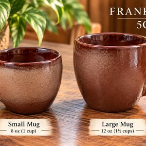 May include: Two brown ceramic mugs labeled Frankoma 5C. The small mug has an 8 oz (1 cup) capacity, while the large mug has a 12 oz (1.5 cups) capacity. Both mugs feature a glossy finish with a textured, speckled appearance and sturdy handles.