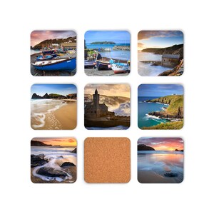 May include: A set of nine coasters featuring scenic coastal views of Cornwall, England. The coasters are made of cork and feature images of beaches, harbours, and the iconic St Michael's Mount.