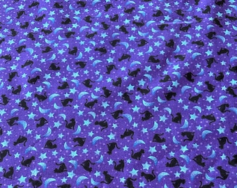 May include: Purple fabric with a repeating pattern of black cats, blue crescent moons, and blue stars.