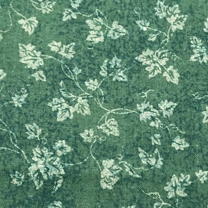 Tessuto in cotone a tema foglia verde