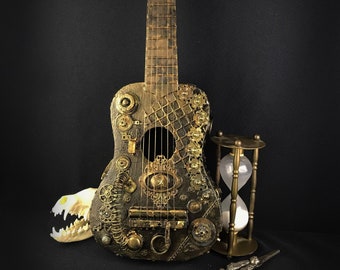 May include: A steampunk-style acoustic guitar with intricate metalwork and gears, a white animal skull, and an hourglass on a black background.