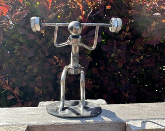 Nuts and Bolts Weight lifter made from recycled nuts, bolts and metal rods