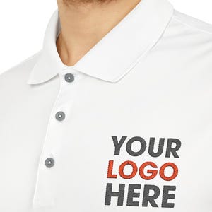 May include: White polo shirt with three grey buttons and the text "YOUR LOGO HERE" embroidered in red and grey.