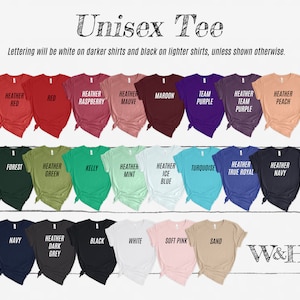 May include: A variety of unisex t-shirts in different colors, including heather red, raspberry, mauve, maroon, team purple, heather peach, forest, heather green, kelly, heather mint, heather ice blue, turquoise, heather true royal, heather navy, navy, heather dark grey, black, white, soft pink, and sand. The lettering will be white on darker shirts and black on lighter shirts, unless shown otherwise.