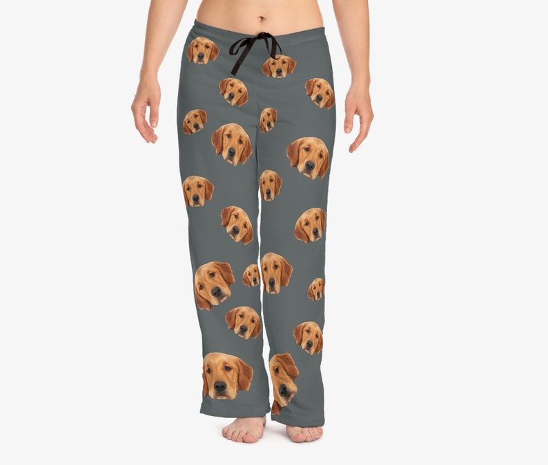 May include: Gray pajama pants with a repeating pattern of a golden retriever's face.