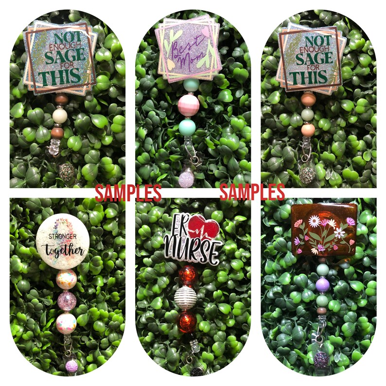 May include: A collection of decorative badge reels with various designs and text. The reels feature phrases like "Not Enough Sage For This", "Best Mom", "Stronger Together", and "ER Nurse". Each reel has a unique bead and charm arrangement.