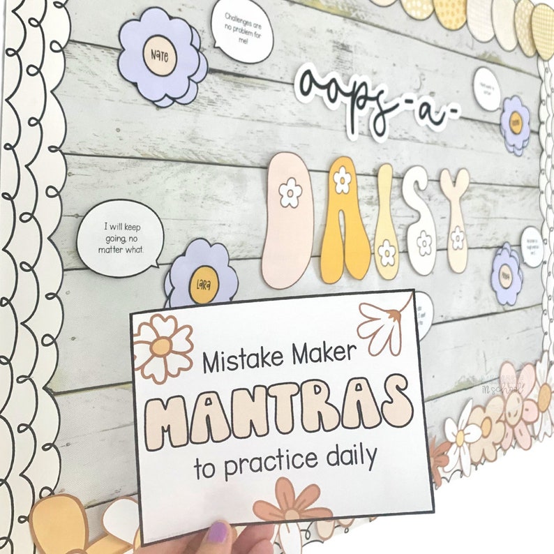 May include: A printable classroom poster with the words "Mistake Maker Mantras to practice daily" in a brown and white daisy design. The poster is surrounded by colorful daisy decorations.
