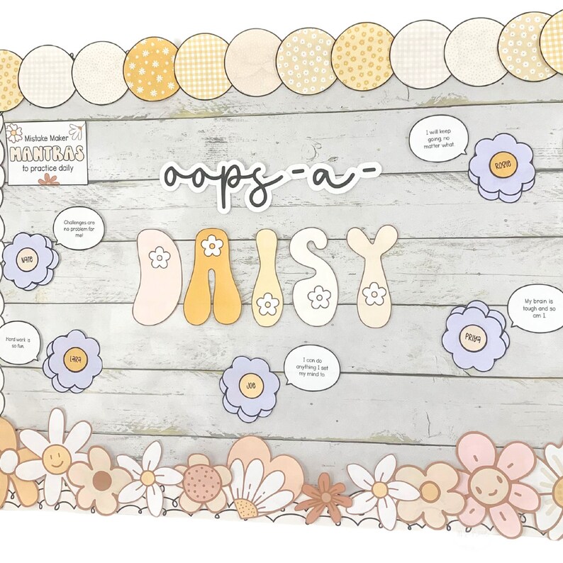 May include: A classroom bulletin board with the word "oops-a-daisy" written in black marker. The board is decorated with colorful flowers and speech bubbles with positive affirmations, such as "I can do anything I set my mind to" and "My brain is tough and so am I."
