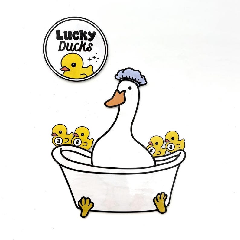 May include: A white goose wearing a blue shower cap sits in a white bathtub with four yellow rubber ducklings. The ducklings have numbers 1, 2, 3, and 4 on them. A round sticker with the text "Lucky Ducks" and a yellow rubber duckling is in the upper left corner of the image.