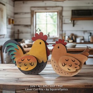 May include: Two wooden chicken figures featuring layered construction. The left figure is a rooster with a red comb, yellow body, and dark gray tail feathers. The right figure is a hen with a red comb and light brown body. Text reads: SVG AI EPS DXF PDF Laser Cut File by SquareOptics.