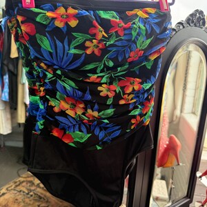 80s floral one-piece swimsuit with ruched back, black nylon with vibrant floral print swimwear