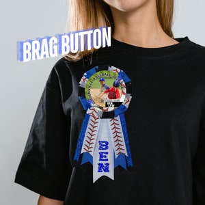 May include: A blue and white baseball-themed brag button with a photo of a young boy playing baseball. The button says "Gunderville Baseball 2021" and "Ben" in blue glitter letters.