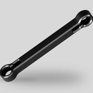 以下が含まれることがあります： 2つの丸い端を持つ黒い金属製のレンチ。レンチは、ナットやボルトの締め付けまたは緩めのために設計されています。