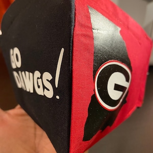 May include: Black and red fabric tote bag with the text "GO DAWGS!" and a white "G" inside a red circle on the red side.
