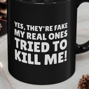 Yes, They're Fake My Real Ones Tried To Kill Me! Funny Breast Cancer Surgery Black Mug 11oz