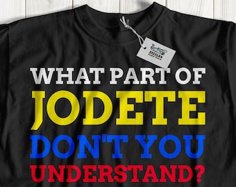 May include: Black t-shirt with the text "WHAT PART OF JODETE DON'T YOU UNDERSTAND?" in yellow, blue, and red letters.
