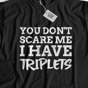 May include: Black t-shirt with white text that reads "You don't scare me I have triplets".