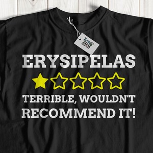 May include: Black t-shirt with white text that reads "Erysipelas" and "Terrible, wouldn't recommend it!" with a one-star rating.