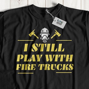 I Still Play With Fire Trucks Unisex Funny Firefighter T-Shirt | Fun Pulaski Shirts