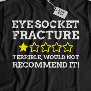 Unisex Lustige Augenhöhle Fraktur T-Shirt | Gebrochene Augenhöhle Geschenkideen | Schwarzes Auge Shirt | Blowout Fraktur Geschenke
