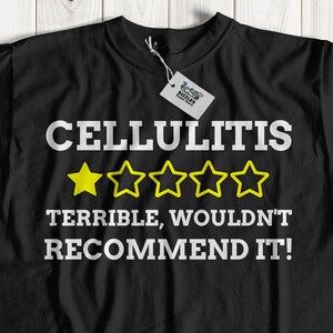 May include: Black t-shirt with a white graphic that says "CELLULITIS" with a one-star rating and the text "TERRIBLE, WOULDN'T RECOMMEND IT!"