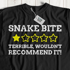 May include: Black t-shirt with a white graphic that says "Snake Bite" with a one-star rating and the text "Terrible, wouldn't recommend it!"