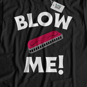 May include: Black t-shirt with white text that reads "BLOW ME!" and a red harmonica graphic.