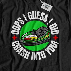 May include: Black t-shirt with a white circle graphic that says "Oops I guess I did crash into you."  Inside the circle is a green, yellow, and white jet ski.