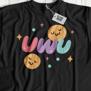 May include: Black t-shirt with a colorful "uwu" graphic featuring cartoon eyes and stars.