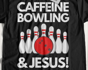 May include: Black t-shirt with white text that reads "CAFFEINE BOWLING & JESUS!" and a graphic of bowling pins and a bowling ball.