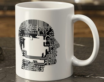 May include: White ceramic mug with a black silhouette of a human head filled with circuit board patterns.
