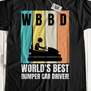 May include: Black t-shirt featuring a retro-style graphic of a bumper car and the text "WBB D World's Best Bumper Car Driver!"