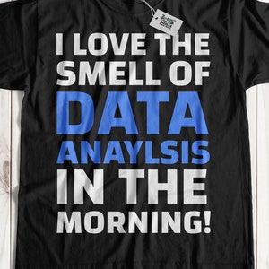 May include: Black t-shirt with white text that reads "I love the smell of data analysis in the morning!"