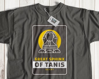 May include: A dark gray t-shirt with a white graphic of the Great Sphinx of Tanis, Egypt. The graphic features a yellow sun behind the sphinx.